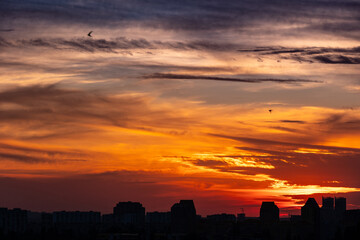 Vibrant sunset clouds over urban landscape in Kyiv