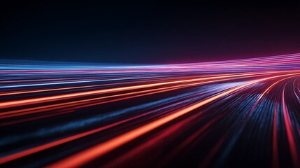 Abstract light trails creating a dynamic and colorful motion blur effect against dark background
