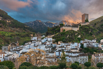 Panoramic view of Cazorla town with Yedra Castle and snow covered mountains at sunset, Jaen, Andalusia, Spain