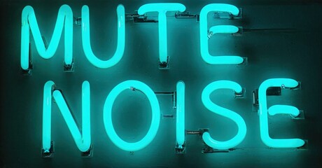 Bright turquoise neon sign displays words Mute Noise. Dark background emphasizes glowing text. Simple, direct message.
