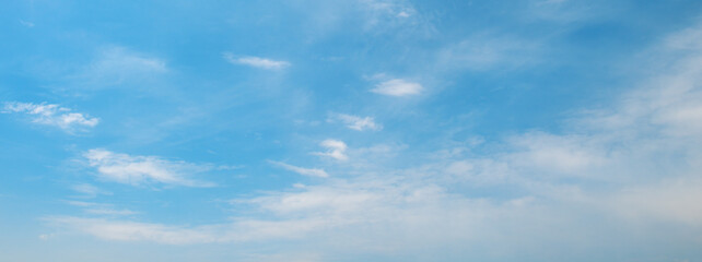 Sky panorama with fluffy and thin clouds creating dynamic texture and contrast across open aerial view