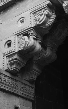 Islamic art carving on the pillar support of wall. It is part wall of Qutab Minar In Delhi, India. It was made in around 14th century AD.