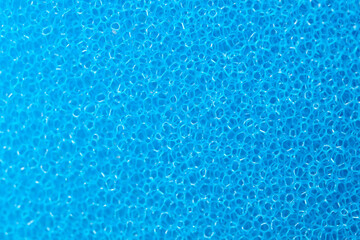Bright blue texture of soft foam creates a calming background