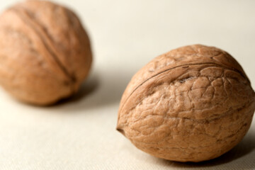 Natural walnuts resting on a smooth surface, ready for a feast