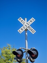 Railroad crossing sign with signal lights