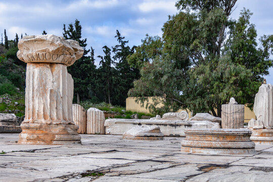 Ruins of ancient Eleusis city in Greece with remains of marble columns and stone fragments