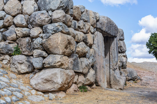 Ancient stone city wall and entrance gate at Hattusa archaeological site in Bogazkale, Turkey