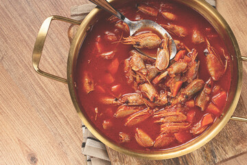 French shrimp bisque soup, in a pot, close-up, no people,