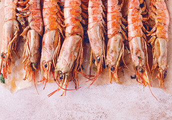 shrimps on skewers, Grilled, spread on a marble surface, garnished, with lemon slices, and fresh herbs, view from above,