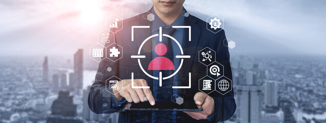 A business professional engages with a tablet featuring user identification and analytics, set against a modern urban skyline, showcasing technology and innovation. Gantry