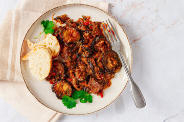 stewed meat with eggplant is a Georgian dish, on a light background,homemade, no people