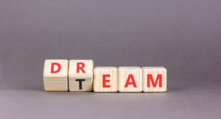 Dream team symbol. Concept words Dream team on beautiful wooden cubes. Beautiful grey table grey...