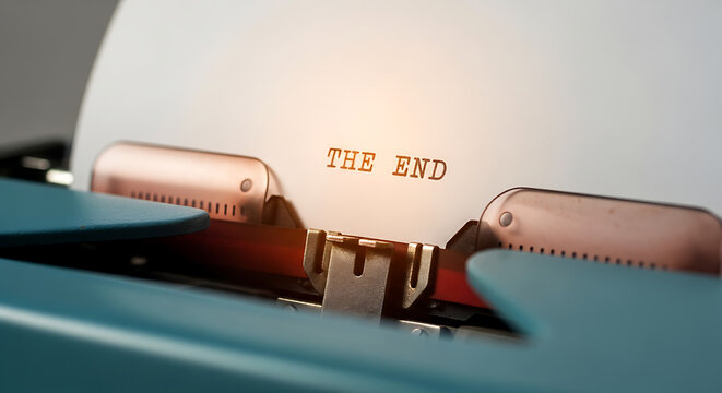 The End typed on a vintage typewriter signaling conclusion or completion of a project