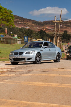 Silver BMW M5 E60 sedan front view driving, Luxury Sedan V10 performance car