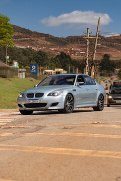 Silver BMW M5 E60 sedan front view driving, Luxury Sedan V10 performance car