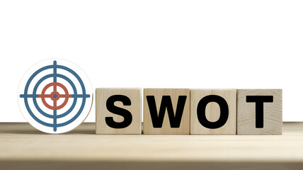 SWOT analysis with target symbol on wooden blocks.