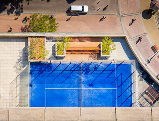 Padel court from above. Aerial view of padel tennis court from balcony of skyscraper