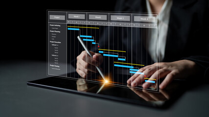A business professional using a digital tablet to analyze project management data through a Gantt chart, showcasing modern planning tools in a sleek office setting. Tessel