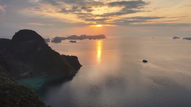 Scenic limestone islands, composed of ancient, uplifted reefs, rise from the seascape in Misool, Indonesia. This region harbors spectacular marine biodiversity and is a popular destination for diving.