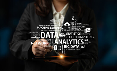 A business professional examines data and analytics on a tablet, showcasing cloud computing and big data concepts in a visually striking dark background. Tessel