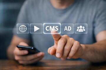 CMS content management system concept, Person using smartphone with content management system icon on virtual screen for business website management.