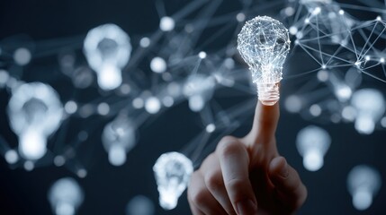 Hand touches glowing digital light bulb