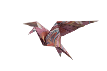 Colorful origami bird in flight