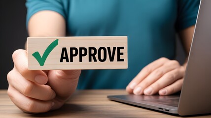 Businessman holding wooden block with text approve for document approval, assessment, approve the loan, finance agreement, loan, stamp, business.