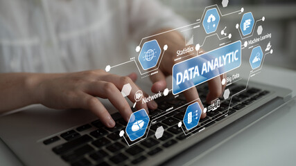 An individual engaging in data analytics on a laptop, visualizing key concepts related to big data, statistics, and machine learning in a modern business environment. Tessel