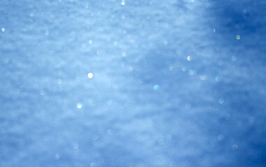 Minimalist New Year background with soft snow texture, glitter, and dreamy bokeh effect