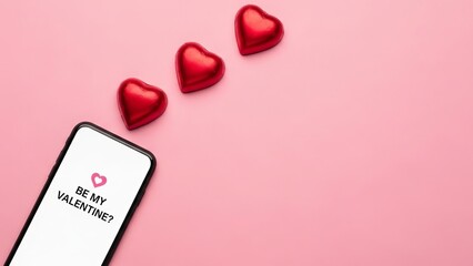 Valentine&rsquo;s Day smartphone with message and red heart chocolates  
