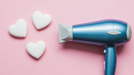 Hair dryer with white heart-shaped objects on pink background  