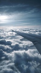 Obraz premium View from an airplane window: a wing in the foreground, with fluffy clouds below and a clear blue sky above. Concept Airplane window view, Wing in foreground, Fluffy clouds below