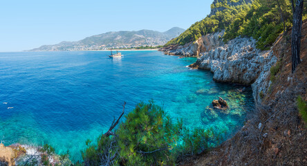 Fototapeta premium Unbelievable seascape with rocky coast and beach views in Turkey, Alanya. Blue clean sky, turquoise sea water and beautiful bay.
