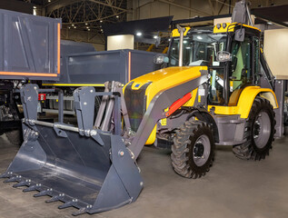 Modern construction machinery showcased at the industry trade fair in vibrant exhibition hall