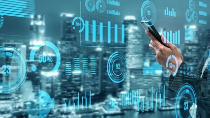 A businessman engages with a smartphone amidst digital data visualizations and graphs, set against a vibrant city skyline, capturing finance and technology themes. Xenic - Powered by Adobe