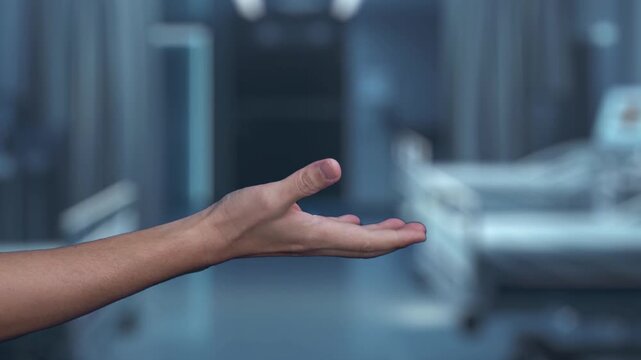 Close up of human hand holding DNA holographic floating at laboratory background. Human hand accessing and connecting medical data by using genetic icon to analyzing and diagnosis symptom. Salubrious.