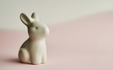 Happy easter sunday celebration with adorable easter bunny figurine on pastel background