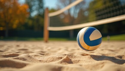 Sand court with volleyball net and ball ready for match on sunny day. Outdoor recreation area invites active summer games and friendly competition. Enjoy sports, fitness, and fun.