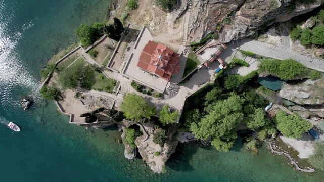 Aerial view of Ohrid with Kaneo beach and church. UNESCO protected heritage - Macedonian Orthodox Church of St. John the Evangelist, located on a cliff above the Kaneo beach