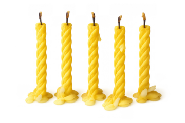 Five yellow twisted beeswax candles with burnt wicks, showing melted wax at base, on transparent background