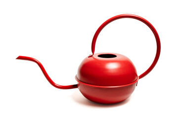 An elegantly designed red metal watering can, isolated against a white background 