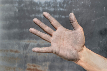 Industrial worker hand symbolizing determination and endurance