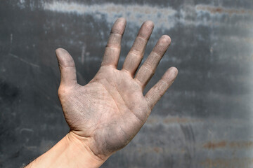 Industrial worker open hand emphasizing workplace safety awareness