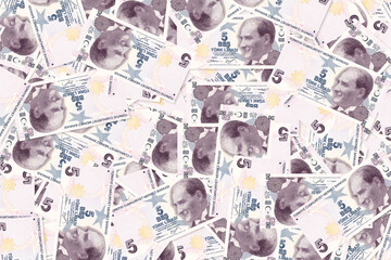 Background of scattered five Turkish Lira banknotes money texture