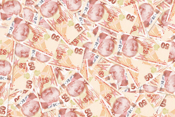 Background of scattered fifty Turkish Lira banknotes money texture