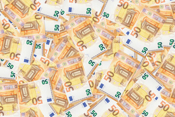 Background of scattered fifty Euro banknotes money texture
