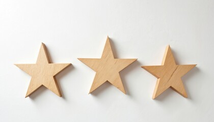 Three wooden stars form simple pattern on plain white background. Natural wood texture, minimalist style suggest decor craft ideas. Create calm, clean aesthetic suitable for various design projects.