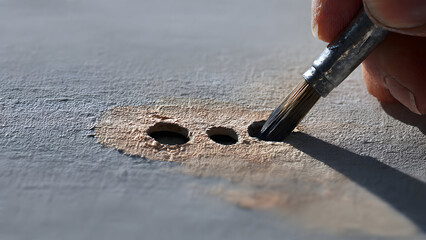 Nail hole repair sanding showing seamless integration of patched areas into existing drywall surface