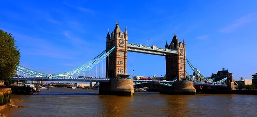 Naklejka premium Tower Bridge is a Grade I listed combined bascule and suspension bridge in London, built between 1886 and 1894, designed by Horace Jones